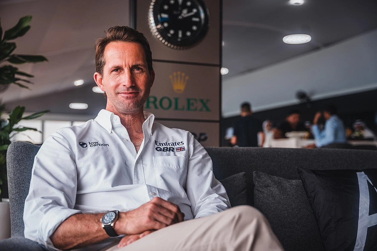Ben Ainslie seated indoors wearing a white Emirates GBR shirt