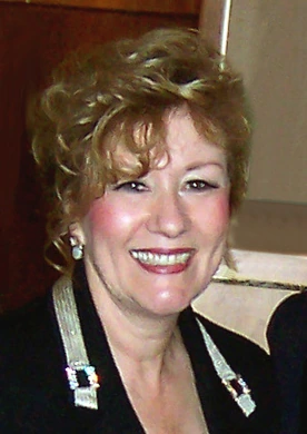 Esther Hicks smiling in a candid portrait photo.